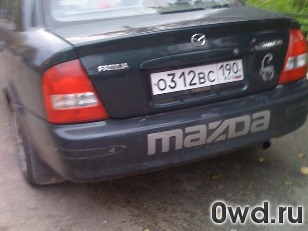 Битый автомобиль Mazda Protege